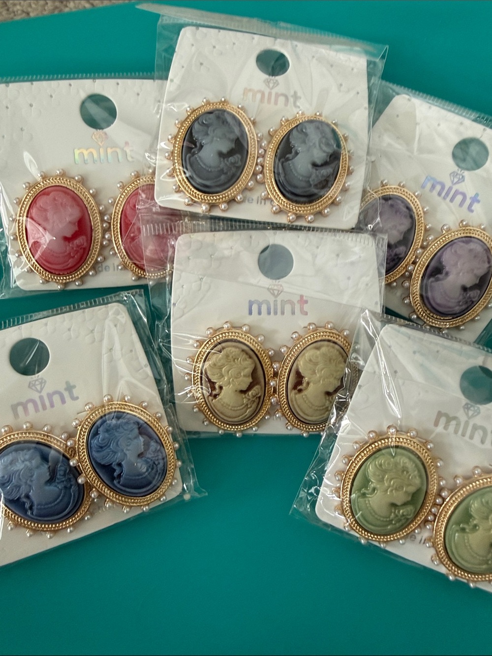 Set of 12 Mint Cameo Earrings in Various Colors. NWT.